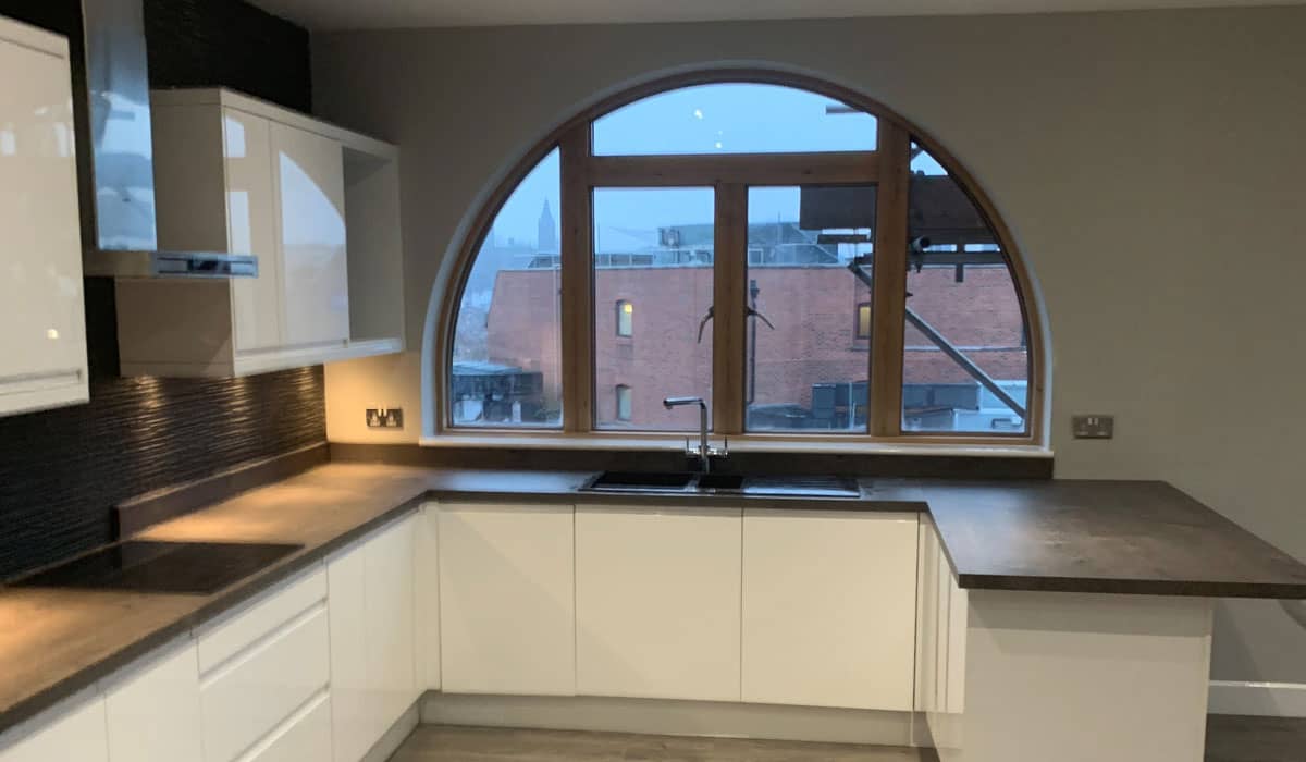 Kitchen with arched window